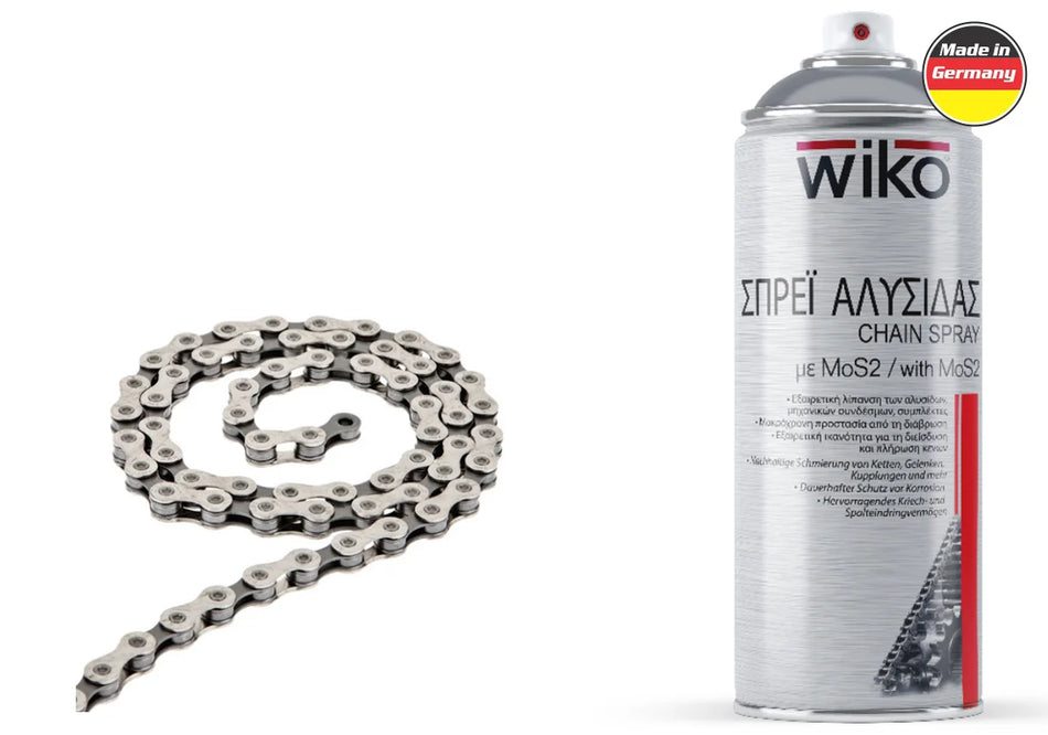 A coiled silver metal bicycle chain shown next to a can of wiko Chain Spray with MoS2, on a plain white background with a 'Made in Germany' badge.
